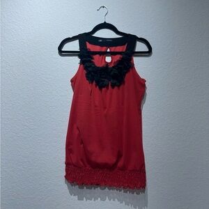 Elegant Red Sleeveless Top with Black Accents